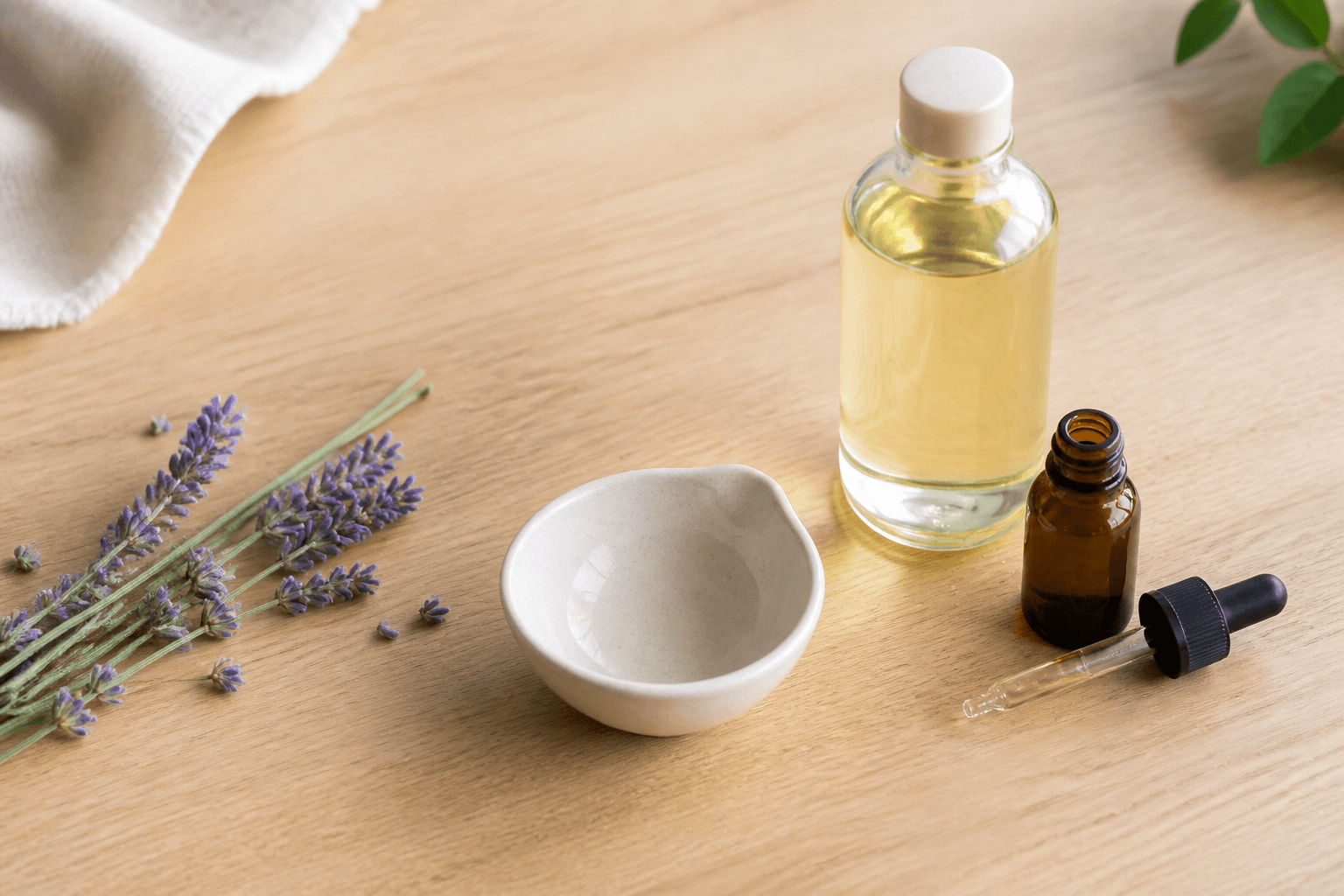 Essential oil, carrier oil and mixing dish for safe dilution
