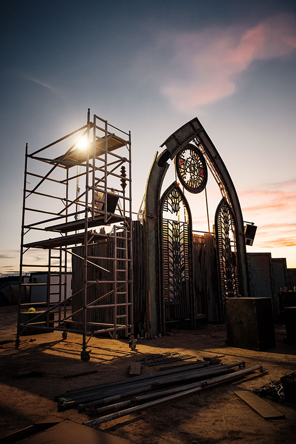 Pointed arch art installation beside scaffolding at Nowhere