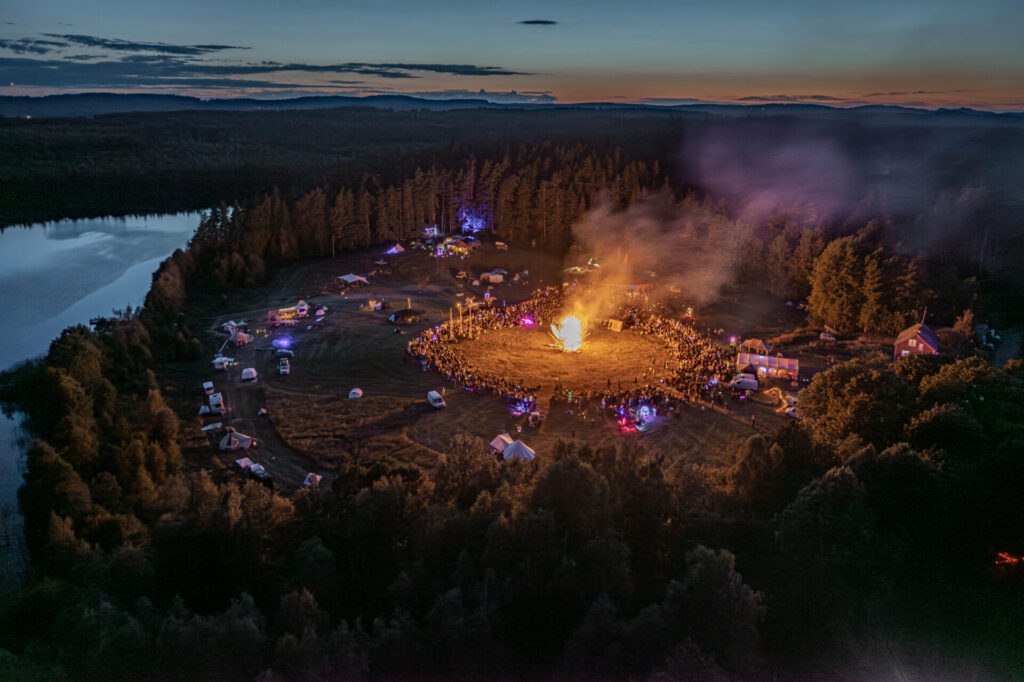 The Borderland, Sweden, 2024: the lakeside gathering and effigy burn at dusk.