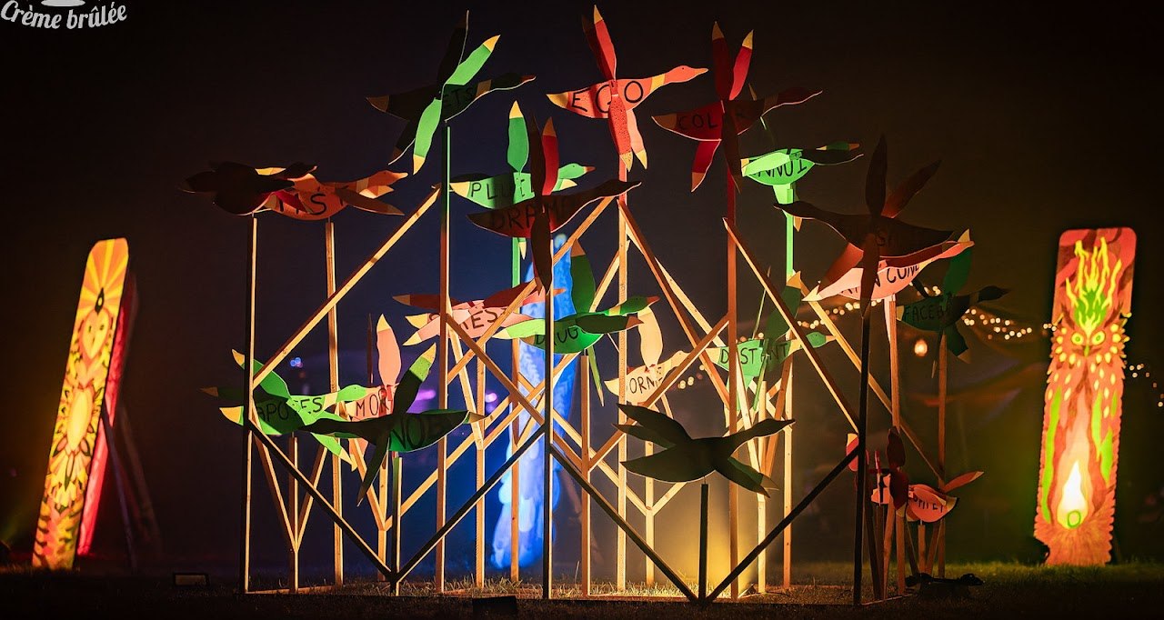Colourful wooden artwork illuminated after dark at Crème Brûlée.