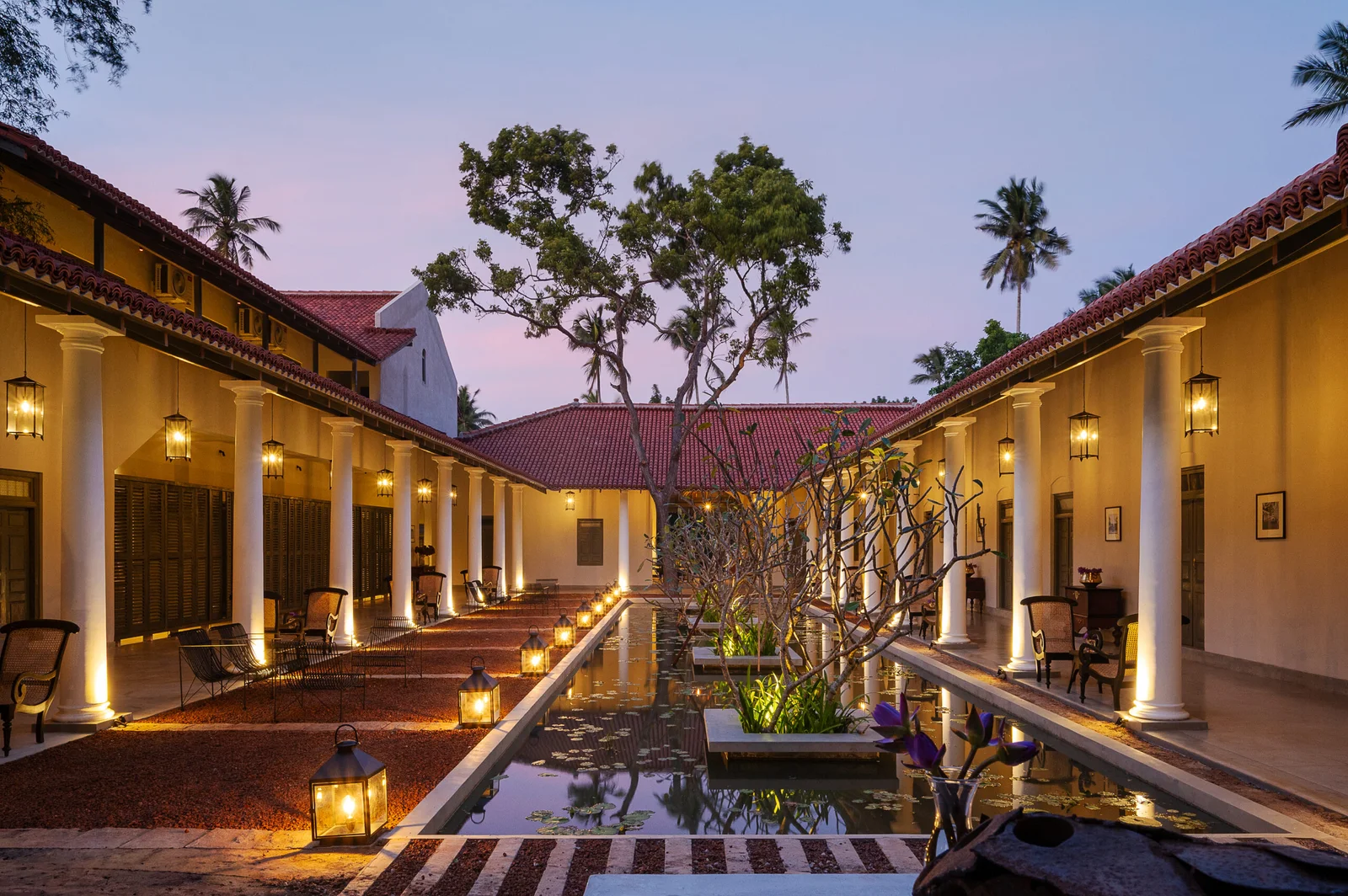 The resort’s lantern-lit courtyard and reflecting pool at dusk.